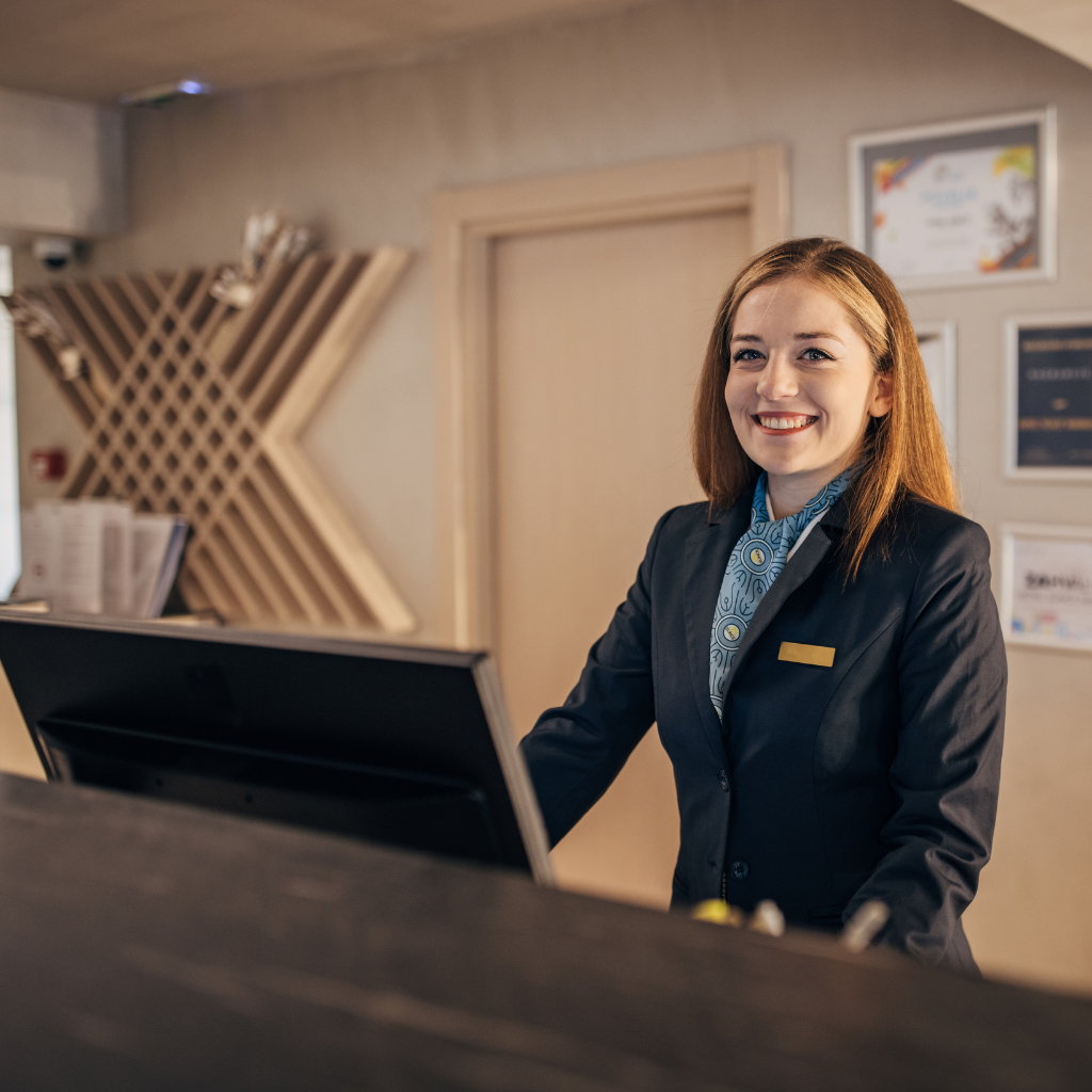 hotel employee smiling